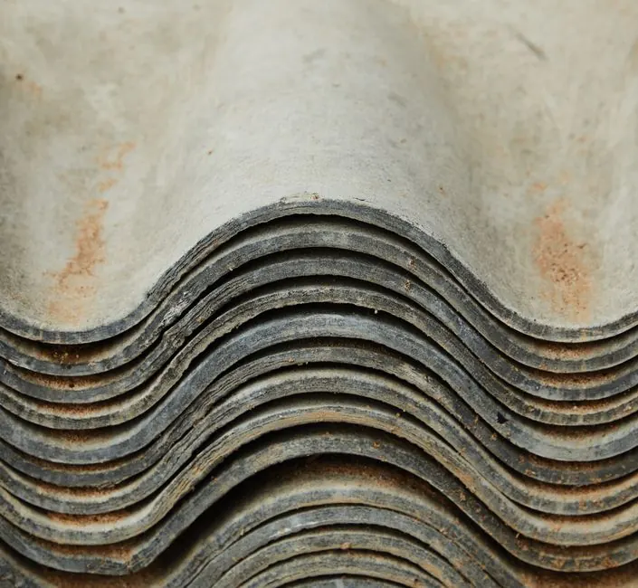 Background of heap of aged rough shabby slate for repairing roof of house